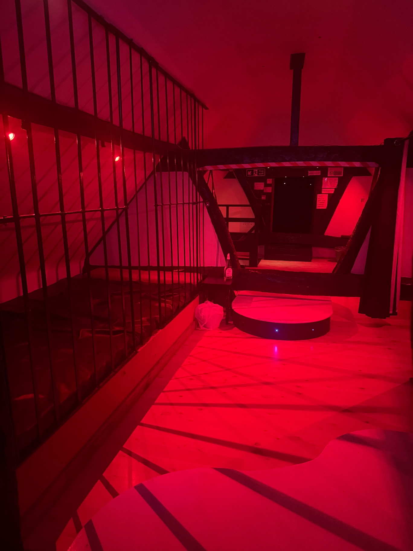 Upstairs play area bathed in deep red light